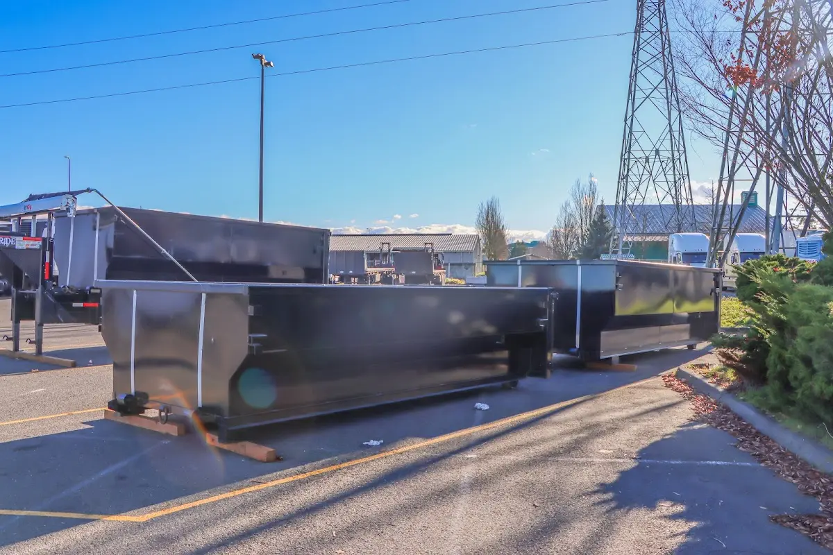 Roll-off dumpster ready for waste disposal at job site for Yard Waste Dumpster Rental in Hopkinton